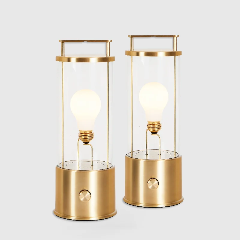 wooden table lamps with natural grain for a warm and organic feelThe Muse Portable Lamp in Solid Brass - Set of 2