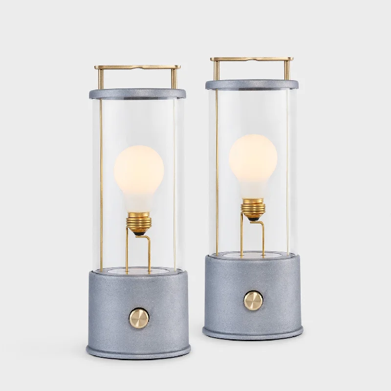 leather table lamps with a distressed texture for a rugged charmThe Rugged Muse Portable Lamp in Raw Aluminium - Set of 2