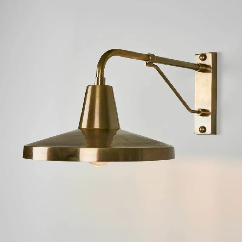 mid - century modern wall lamps with iconic shapes for a stylish studyTrinity Wall light Antique Brass