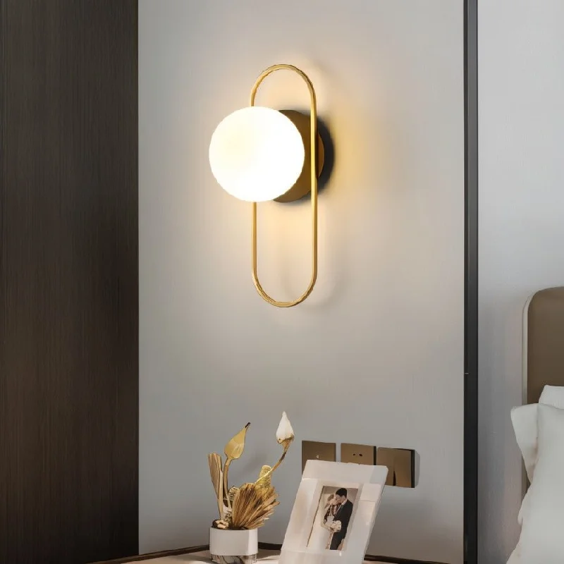 wood wall lamps with natural grain for a warm and organic feelNidia Wall Lamp