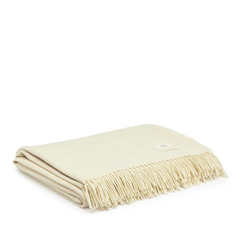 King - size blankets to cover large beds comfortablyLambswool throw cream